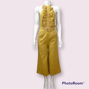 Mustard yellow halter neck cropped ankle belted jumpsuit with ruffled details